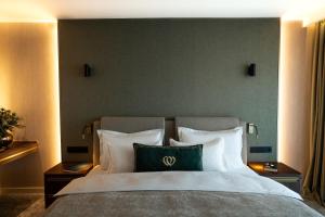 Łóżko lub łóżka w pokoju w obiekcie Le Primore Hotel & Spa