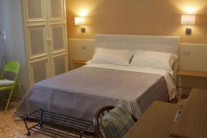 Posteľ alebo postele v izbe v ubytovaní B&B I Propilei di San Girolamo