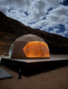 a tent sitting in the middle of a desert at Emma Luxury Camp in Wadi Rum