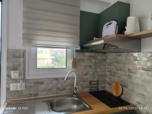 Kuchyň nebo kuchyňský kout v ubytování Filomeni Studios + 37 fotografií