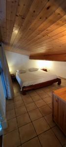 Postel nebo postele na pokoji v ubytování La Rose des Vents & Spa - Gite Savane
