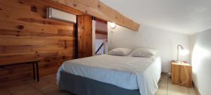 Postel nebo postele na pokoji v ubytování La Rose des Vents & Spa - Gite Savane