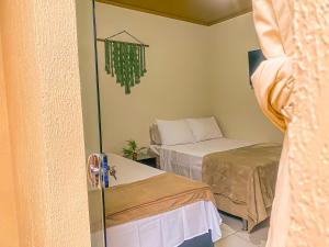 Postel nebo postele na pokoji v ubytování Pousada Quartzo