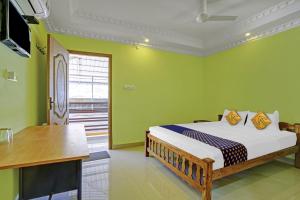 Ένα ή περισσότερα κρεβάτια σε δωμάτιο στο Hotel O SS Residency