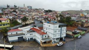 an overhead view of a city with houses and a street at Hotel vista alegre in Itapeva