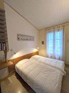 Ένα ή περισσότερα κρεβάτια σε δωμάτιο στο Appartement Neptune