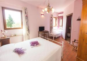 Posteľ alebo postele v izbe v ubytovaní Agriturismo Maloura