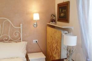 Posteľ alebo postele v izbe v ubytovaní B&B I Propilei di San Girolamo