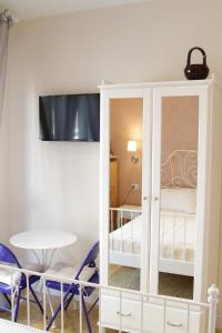 Posteľ alebo postele v izbe v ubytovaní B&B I Propilei di San Girolamo