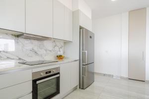 Η κουζίνα ή μικρή κουζίνα στο YAMAS Urban Living Platinum 77 Penthouse