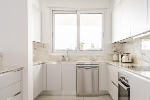 Η κουζίνα ή μικρή κουζίνα στο YAMAS Urban Living Platinum 77 Penthouse