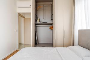 Ένα ή περισσότερα κρεβάτια σε δωμάτιο στο YAMAS Urban Living Platinum 77 Penthouse