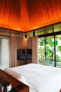 Katil atau katil-katil dalam bilik di Tanawana Borobudur Living