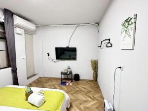 TV o dispositivi per l'intrattenimento presso 希沐溫泉行旅