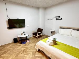 TV o dispositivi per l'intrattenimento presso 希沐溫泉行旅