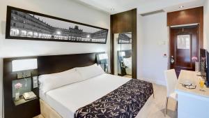 Postel nebo postele na pokoji v ubytování Sercotel Las Torres