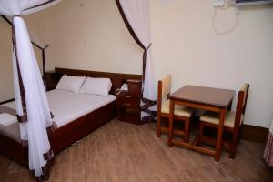 Postel nebo postele na pokoji v ubytování Hotel Acacia View