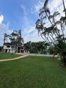 a resort with a swimming pool and palm trees at Finca Luciana in Jamundí +40 photos