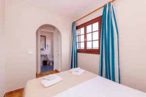 Ένα ή περισσότερα κρεβάτια σε δωμάτιο στο Siesta Mar One Bedroom Apartments +13 φωτογραφίες