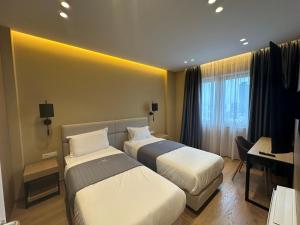 Postel nebo postele na pokoji v ubytování Mulaj Hotel