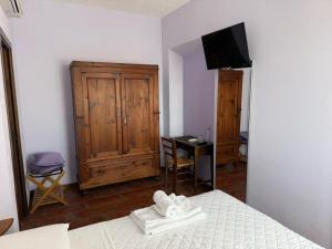 Postel nebo postele na pokoji v ubytování Agriturismo Maloura