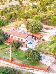 an aerial view of a building with a playground at Old stone house with swimming pool Etno House Perazic in Bar +25 photos