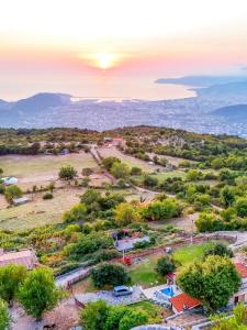 an aerial view of a village with a sunset in the sky at Old stone house with swimming pool Etno House Perazic in Bar