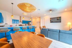 a living room with a table and a couch at Palm Paradise in South Padre Island