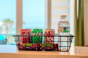 a basket of chips and a bottle of water on a table at Palm Paradise in South Padre Island