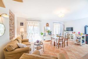 a living room with a couch and a table at Casa Peronospora by Kompas Villas in Čepljani