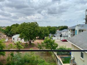 a view from a window of a residential neighbourhood at KS Unique Studio Apartment in Accra