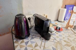 an appliance is sitting on a counter top at Emme Loft I New Moon - Stylish Apartment with Balcony in Milan