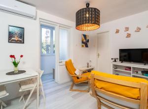 TV a/nebo společenská místnost v ubytování Apartment Butterfly