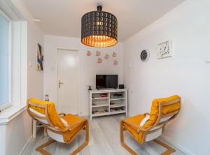 TV a/nebo společenská místnost v ubytování Apartment Butterfly