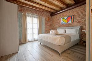 Postel nebo postele na pokoji v ubytování New Moon - Emme Loft