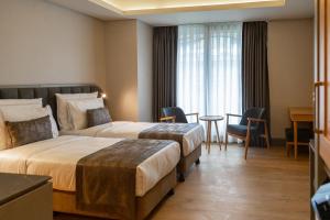 Meroddi Beyoğlu Residence客房内的一张或多张床位