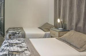 Postel nebo postele na pokoji v ubytování Hotel El Rosedal