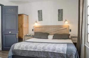 Postel nebo postele na pokoji v ubytování Hotel El Rosedal