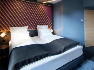 Postel nebo postele na pokoji v ubytování B&B Hotel Bad Homburg