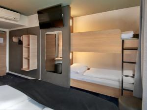 Postel nebo postele na pokoji v ubytování B&B Hotel Bad Homburg