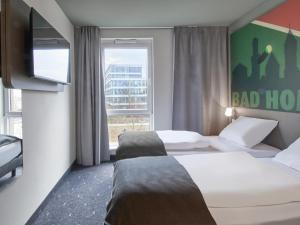 Postel nebo postele na pokoji v ubytování B&B Hotel Bad Homburg