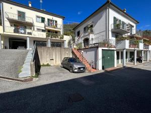 a car parked in a parking lot in front of a building at Casa Sarina Modern apartment with city and sea view up to 6 ppl garage on request in La Spezia