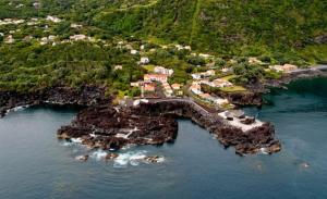an aerial view of an island in the water at Faial Oceanfront Getaway AL in Horta