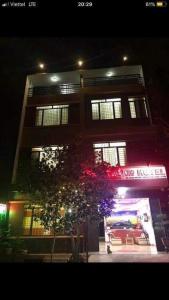 a building with a car in front of it at night at Công Thành Hotel in Lao Cai