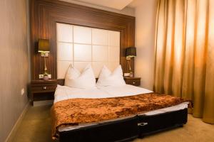 Voodi või voodid majutusasutuse Duna Garden Hotel toas