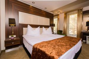 Voodi või voodid majutusasutuse Duna Garden Hotel toas