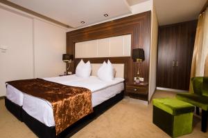Voodi või voodid majutusasutuse Duna Garden Hotel toas