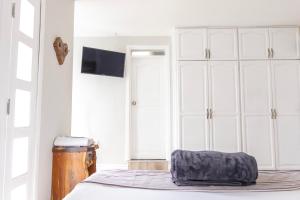 Postel nebo postele na pokoji v ubytování Casa Hotel Alicia Filandia