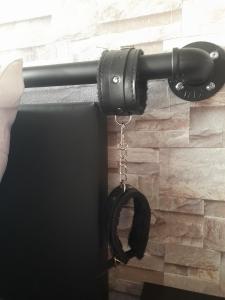a flashlight hanging from a door handle at L'art du désir in Le Saulcy