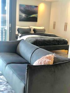 a living room with two beds and a couch at 601 The Cosmopolitan in Cape Town